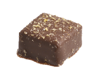 Čokoládově smetanová ganache se zeleným voňavým čajem, zázvorem, s přidáním pomerančové a citrónové kůry v mléčné čokoládě